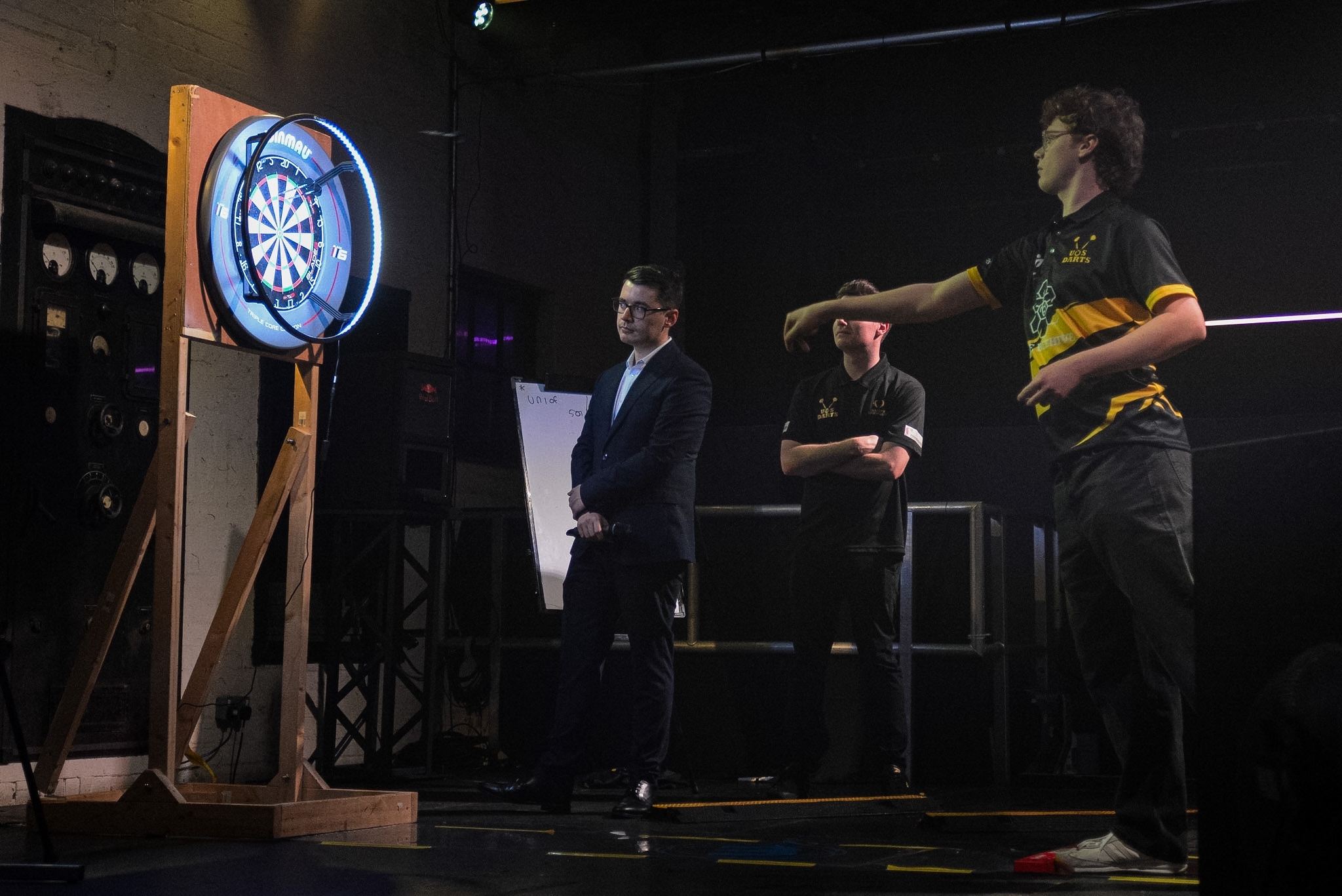 Matthew Duke competing on stage at Sheffield Varsity darts